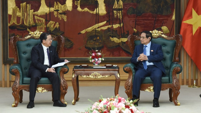 Thủ tướng Chính phủ Phạm Minh Chính tiếp ông Bành Cương Bình, Chủ tịch HĐQT Công ty hữu hạn Tập đoàn Khoa học Kỹ thuật Hoa Điện Trung Quốc (CHEC). (Ảnh: TRẦN HẢI)