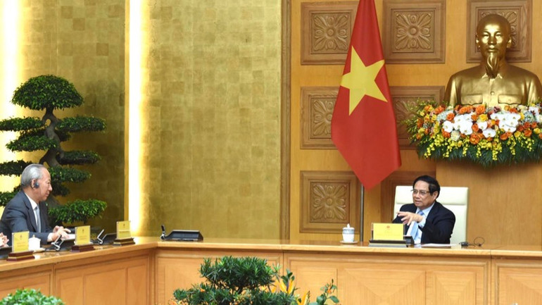 Thủ tướng Phạm Minh Chính và ông Nghiêm Giới Hòa. (Ảnh: Trần Hải)