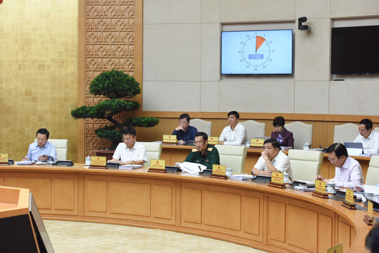 Các Thành viên Chính phủ và đại biểu tham dự phiên họp. (Ảnh: Trần Hải)