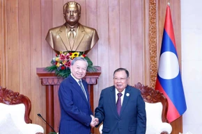 Tổng Bí thư Tô Lâm gặp nguyên Tổng Bí thư, Chủ tịch nước Lào Bounnhang Vorachit. (Ảnh: Thống Nhất/TTXVN)