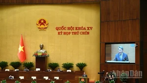 Quốc hội làm việc tại hội trường nghe Tờ trình và Báo cáo thẩm tra dự thảo Nghị quyết của Quốc hội về cơ chế xử lý khó khăn, vướng mắc do quy định của pháp luật. (Ảnh: DUY LINH)