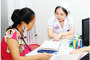 Nhiều chính sách mới liên quan đến BHYT được triển khai nhằm tăng quyền lợi cho người tham gia. Ảnh: NAM NGUYỄN