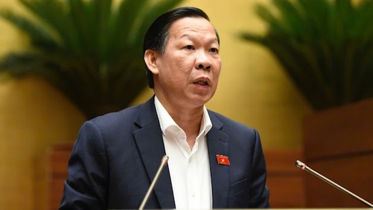 Chủ nhiệm Ủy ban Kinh tế và Tài chính của Quốc hội Phan Văn Mãi trình bày Báo cáo thẩm tra Tờ trình của Chính phủ về dự án Luật sửa đổi, bổ sung một số điều của Luật Doanh nghiệp. (Ảnh: DUY LINH)