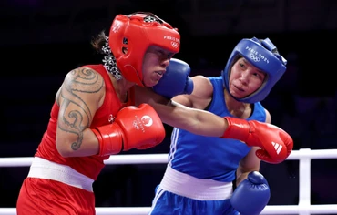 Hà Thị Linh (áo xanh) giành chiến thắng đầy thuyết phục trước võ sĩ người Tonga. (Ảnh: Olympic Paris)