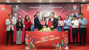 Đại diện 2 bên ký kết hợp tác chương trình “Tết sẻ chia, năm Rồng khởi sắc". 