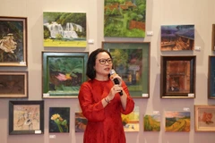 Bà Nguyễn Liên Hương, Phó Giám đốc Trung tâm Hoạt động văn hóa, khoa học Văn Miếu-Quốc Tử Giám phát biểu khai mạc triển lãm.