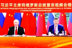 Hai nhà lãnh đạo Nga và Trung Quốc hội đàm trực tuyến. (Ảnh: TÂN HOA XÃ)