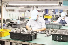 Doanh nghiệp sản xuất, kinh doanh hàng hóa xuất khẩu có nhu cầu vay vốn lớn. (Ảnh: THẾ ANH)
