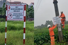 EVNHANOI lắp đặt hệ thống biển cảnh báo bảo vệ hành lang an toàn lưới điện. 