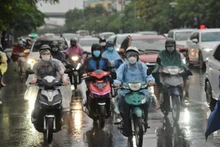 Khu vực Hà Nội có mưa, trời rét với nhiệt độ thấp nhất 12-14 độ C. (Ảnh minh họa)