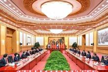 Hội đàm giữa Tổng Bí thư, Chủ tịch Trung Quốc Tập Cận Bình và Tổng Bí thư, Chủ tịch nước Lào Thongloun Sisoulith. (Ảnh: Tân Hoa Xã)