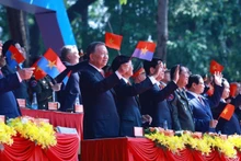 Các đồng chí lãnh đạo, nguyên lãnh đạo Đảng, Nhà nước và bạn bè quốc tế dự buổi lễ. (Ảnh TTXVN)