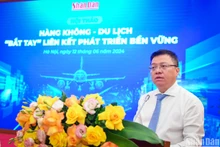 Đồng chí Lê Quốc Minh, Ủy viên Trung ương Đảng, Tổng Biên tập Báo Nhân Dân, Phó Trưởng Ban Tuyên giáo Trung ương, Chủ tịch Hội Nhà báo Việt Nam phát biểu tại hội thảo.