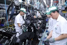 Người lao động kiểm tra sản phẩm tại Công ty Honda Việt Nam. 