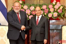Chủ tịch nước Nguyễn Xuân Phúc tiếp Thủ tướng Cộng hòa Cuba Manuel Marrero Cruz. (Ảnh: ĐĂNG KHOA)