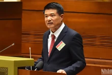 Viện trưởng Viện Kiểm sát nhân dân tối cao Nguyễn Huy Tiến trình bày Tờ trình tóm tắt dự án Nghị quyết của Quốc hội. (Ảnh: THỦY NGUYÊN)