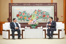 Thủ tướng Chính phủ Phạm Minh Chính hội kiến đồng chí Viên Gia Quân, Ủy viên Bộ Chính trị Trung ương Đảng Cộng sản Trung Quốc, Bí thư Thành ủy Trùng Khánh (Ảnh: Nhật Bắc/VGP). 