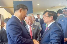 Thủ tướng Phạm Minh Chính có cuộc tiếp xúc với Tổng Bí thư, Chủ tịch Trung Quốc Tập Cận Bình.(Ảnh: Nhật Bắc/VGP).