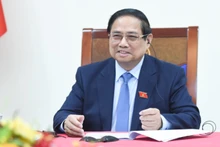 Thủ tướng Phạm Minh Chính điện đàm với Thủ tướng Singapore Lawrence Wong (Ảnh: TRẦN HẢI). 