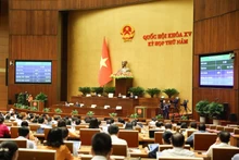 Quốc hội biểu quyết thông qua Luật Phòng thủ dân sự. (Ảnh: DUY LINH)