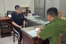 Bị can Nguyễn Thị Thanh Ngọc làm việc với cơ quan chức năng. (Ảnh: Công an cung cấp)