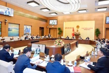 Phiên họp thứ 21 của Ủy ban Thường vụ Quốc hội cho ý kiến về dự án Luật Nhà ở (sửa đổi). (Ảnh DUY LINH)