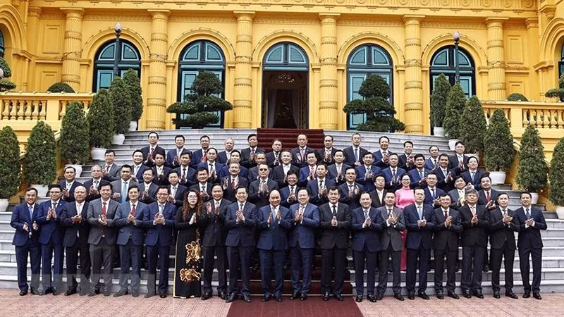 Chủ tịch nước Nguyễn Xuân Phúc với các đại biểu. (Ảnh: Thống Nhất/TTXVN) 