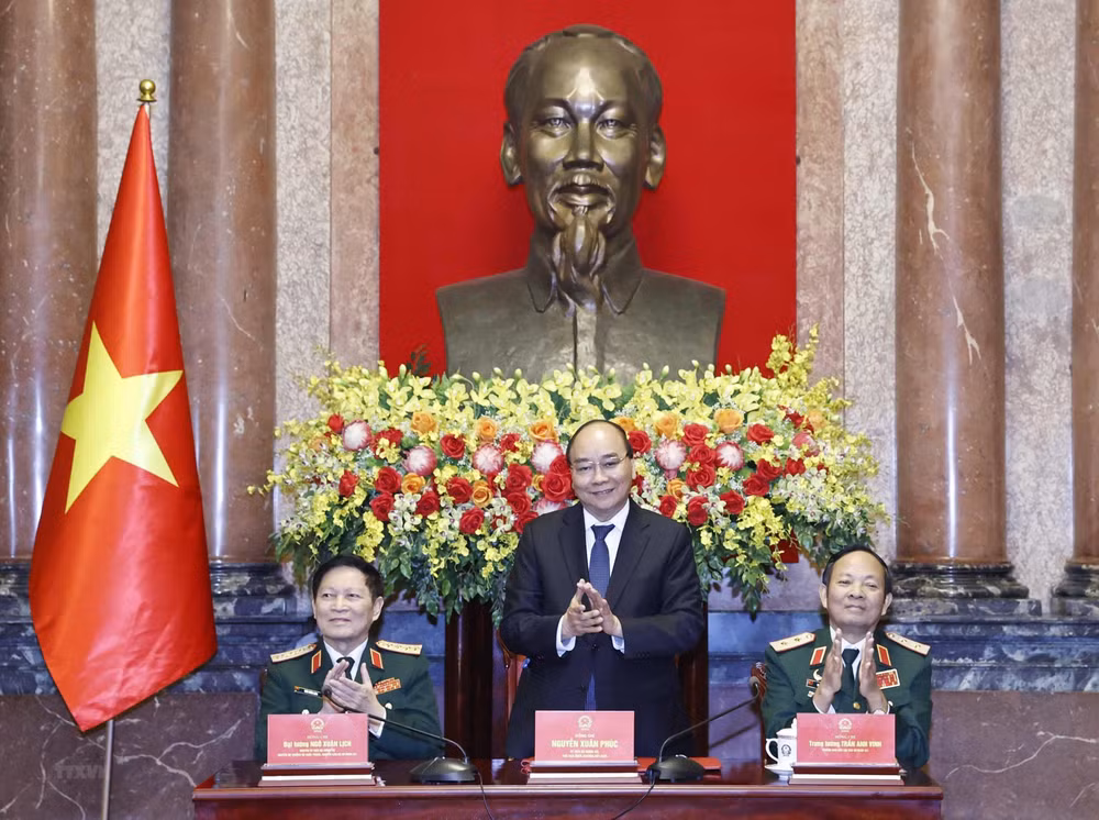 Chủ tịch nước Nguyễn Xuân Phúc chủ trì buổi gặp mặt. (Ảnh: TTXVN)