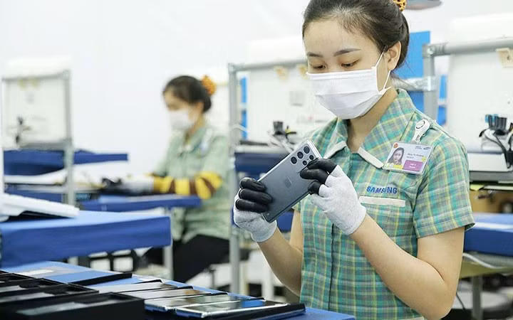 Trong thực hiện mục tiêu tăng trưởng xanh, Chính phủ Việt Nam tiếp tục cam kết mạnh mẽ về tạo mọi điều kiện thuận lợi để các doanh nghiệp phát triển. Ảnh: TTXVN