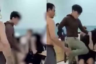 Hình ảnh bảo vệ dân phố đánh đập hai thiếu niên.