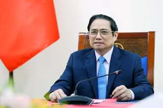 Thủ tướng Phạm Minh Chính điện đàm với Thủ tướng Italia Mario Draghi. (Ảnh: TTXVN)