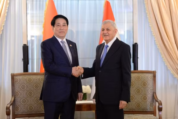 Chủ tịch nước Lương Cường gặp Tổng thống Iraq Abdul Latif Rashid. (Ảnh: XUÂN KỲ)