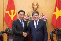 Đồng chí Bounleua Phandanouvong, quyền Trưởng ban Đối ngoại Trung ương Đảng Nhân dân Cách mạng Lào và đồng chí Nguyễn Duy Bắc, Phó Giám đốc Thường trực Học viện Chính trị quốc gia Hồ Chí Minh. 