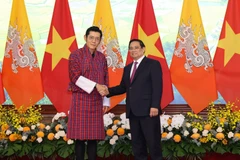 Thủ tướng Chính phủ Phạm Minh Chính và Quốc vương Bhutan Jigme Khesar Namgyel Wangchuck. (Ảnh: TRẦN HẢI)