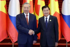 Tổng Bí thư Tô Lâm và Tổng Bí thư, Chủ tịch nước Lào Thongloun Sisoulith. (Ảnh: TTXVN)