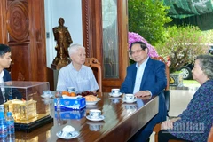 Thủ tướng Chính phủ Phạm Minh Chính thăm, chúc Tết nguyên Chủ tịch nước Nguyễn Minh Triết. (Ảnh: THANH GIANG)