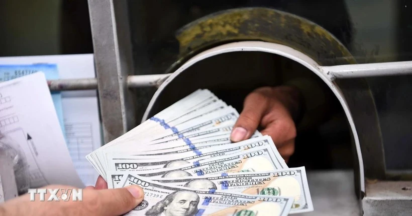Giao dịch đồng USD. (Ảnh: THX/TTXVN)