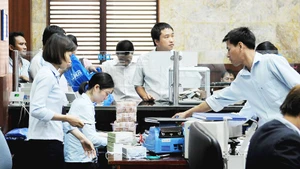 Rào cản về tín dụng vẫn là gánh nặng đối với phần lớn doanh nghiệp nhỏ và vừa. Ảnh: NGUYỆT ANH