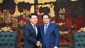 Thủ tướng Phạm Minh Chính đón Phó Thủ tướng Chính phủ, Trưởng Ban Cải cách doanh nghiệp Lào Saleumxay Kommasit.