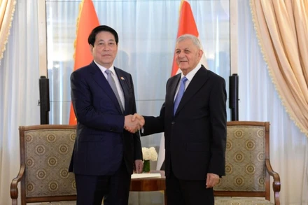 Chủ tịch nước Lương Cường gặp Tổng thống Iraq Abdul Latif Rashid. (Ảnh: XUÂN KỲ)