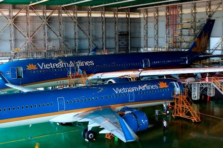 Tách bạch việc sử dụng nguồn lực nhà nước trong cung cấp dịch vụ công, thực hiện nhiệm vụ chính trị với các hoạt động kinh doanh sẽ tạo cơ sở để nâng cao hiệu quả hoạt động của doanh nghiệp nhà nước. (Ảnh Khiếu Minh)