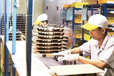 Sản xuất linh kiện cơ khí phục vụ xuất khẩu tại Công ty TNHH Kondo Việt Nam, Khu công nghiệp Hiệp Phước, Thành phố Hồ Chí Minh. (Ảnh THẾ ANH)