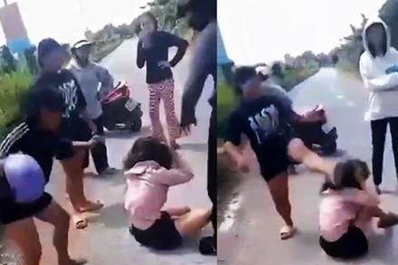 Cháu N (áo hồng) bị nhóm người vây đánh rất dã man (ảnh cắt từ video)