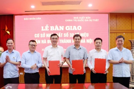 Lễ bàn giao cơ sở nhà đất giữa Báo Nhân Dân và Nhà xuất bản Chính trị quốc gia Sự thật.