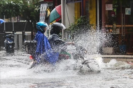 Cảnh ngập lụt sau những trận mưa lớn do ảnh hưởng của bão Wipha tại Quezon, Philippines. Ảnh tư liệu: THX/TTXVN