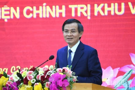 Đồng chí Đoàn Minh Huấn, Ủy viên Bộ Chính trị, Bí thư Đảng ủy, Giám đốc Học viện Chính trị quốc gia Hồ Chí Minh phát biểu tại buổi làm việc. (Ảnh: ANH ĐÀO)