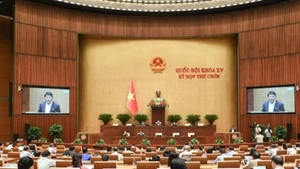 Quốc hội làm việc tại hội trường nghe Tờ trình và Báo cáo thẩm tra dự án Luật sửa đổi, bổ sung một số điều của Bộ luật Hình sự, ngày 20/5/2025. (Ảnh: BÙI GIANG)