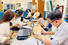 Vận hành thử nghiệm mô hình chính quyền địa phương 2 cấp tại Trung tâm dịch vụ hành chính công xã Phú Xuyên (Hà Nội). (Ảnh: Sơn Tùng)