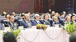 Các chuyên gia, nhà đầu tư quốc tế tham dự Hội thảo “Phát triển Trung tâm tài chính khu vực và quốc tế tại Việt Nam”. (Ảnh HS)