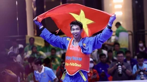 Nguyễn Thanh Liêm sau khi thắng áp đảo đối thủ Emmanuel Dailay Cantores (Philippines) ở chung kết. (Ảnh: Hoàng Linh/TTXVN) 